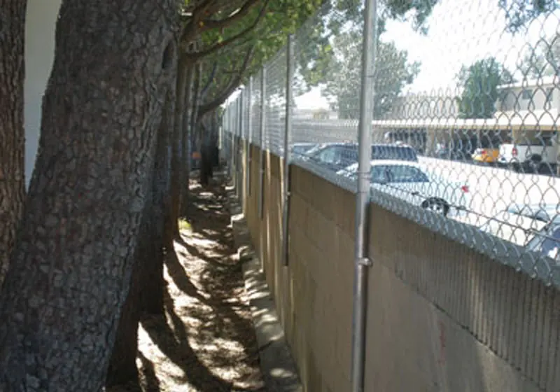 Chain Link Fence Bolted To Blockwall