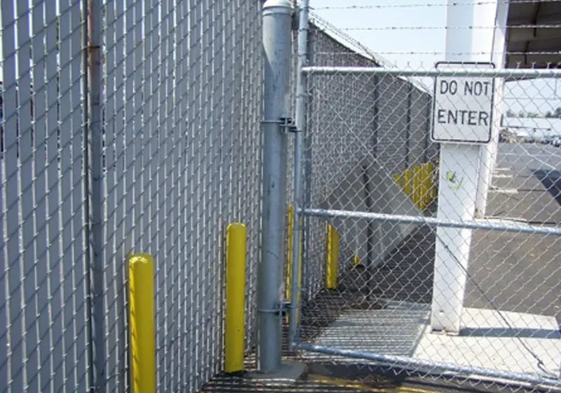 Slatted Chain Link w/ Bumper Posts And Security Fencing